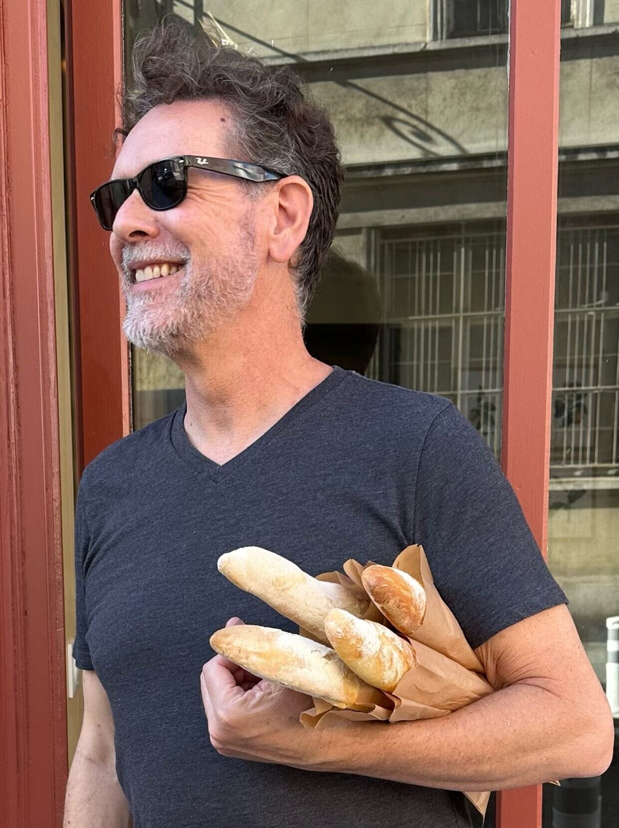 Jordan Graham carrying a bag of warm baguettes